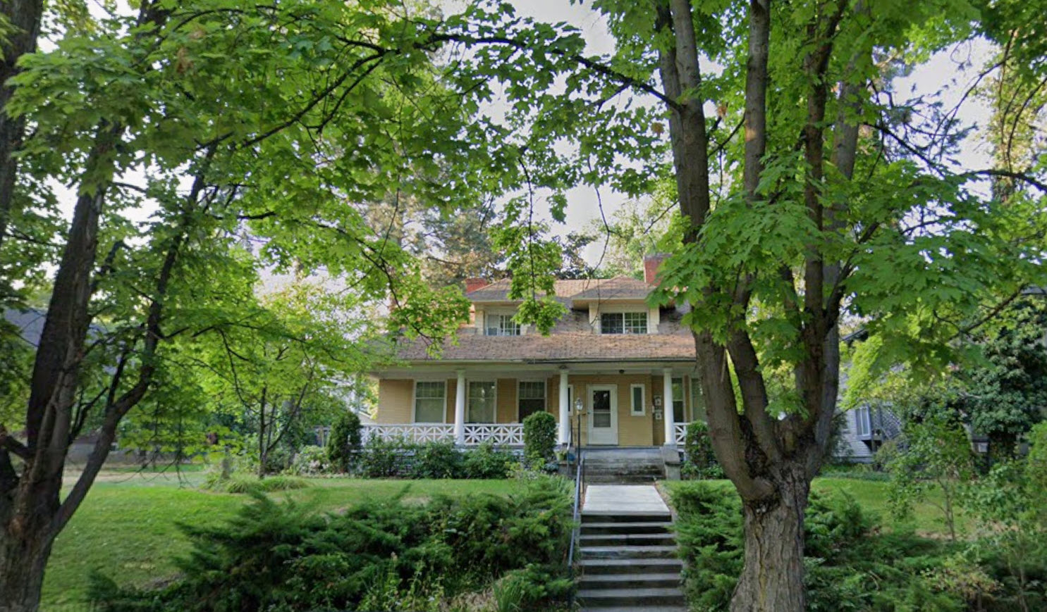 Existing house at 1611 W 9th Ave, Spokane, surrounded by mature trees